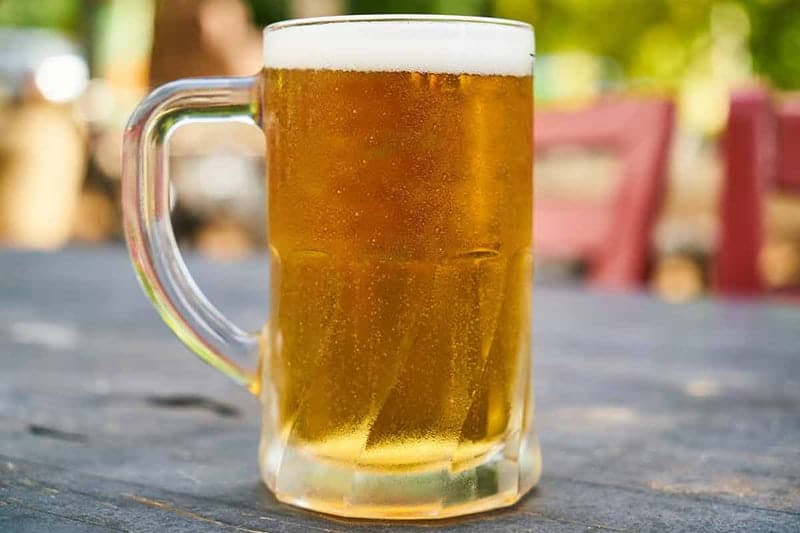 How to frost a beer mug in the freezer. A beer mug with a thin film of frost and a cold beer.